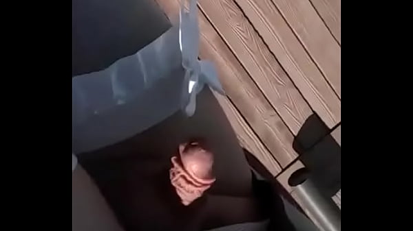 Sissy in public smoking wearing lingerie with tiny penis exposed