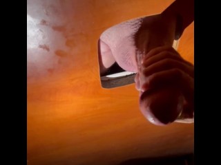 Jerking off a huge dick in a gay sex club