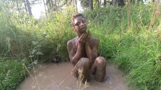 Strip completely naked in the forest and cover body with mud