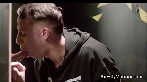 Des Irez is offered the position of janitor at a sex club and while he is cleaning glory hole booth Mason Lear shoves dick through hole for a blowjob